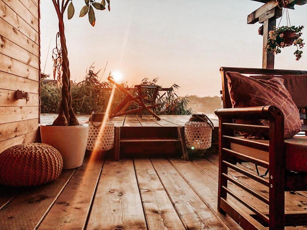 a wooden deck with a bench and a table at Zen House for 2 in Ulcinj