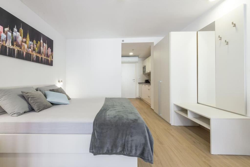 Posteľ alebo postele v izbe v ubytovaní Studios Manhattan