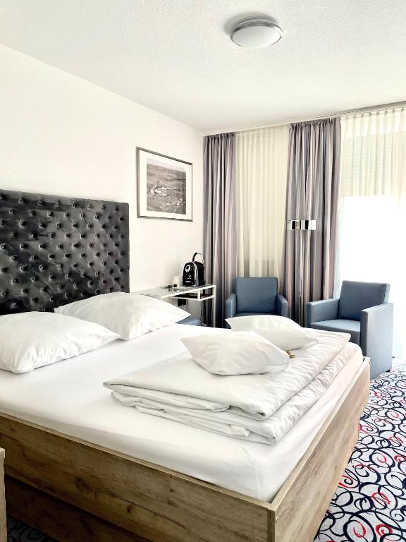 Postel nebo postele na pokoji v ubytování Pfefferhöhe Hotel & Restaurant