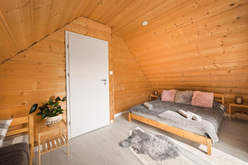 Postel nebo postele na pokoji v ubytování Bajkowe Domki