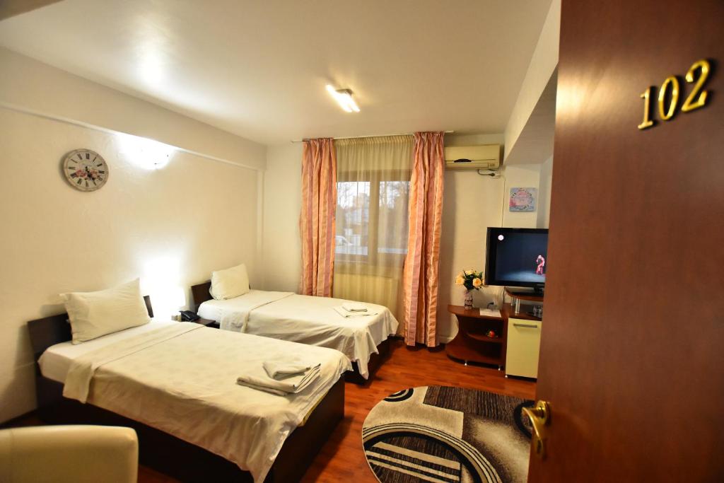 Postel nebo postele na pokoji v ubytování Hotel Euphoria