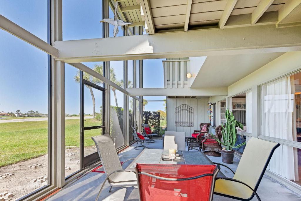 an indoor patio with a table and chairs and windows at Ponte Vedra Deer Run 9770, Pool, 4 Bedrooms, Sleeps 8 in Ponte Vedra