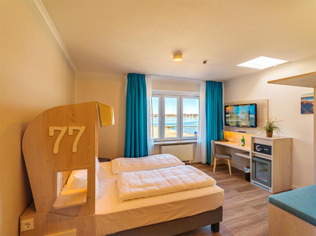 TV a/nebo společenská místnost v ubytování Hotel Seelust