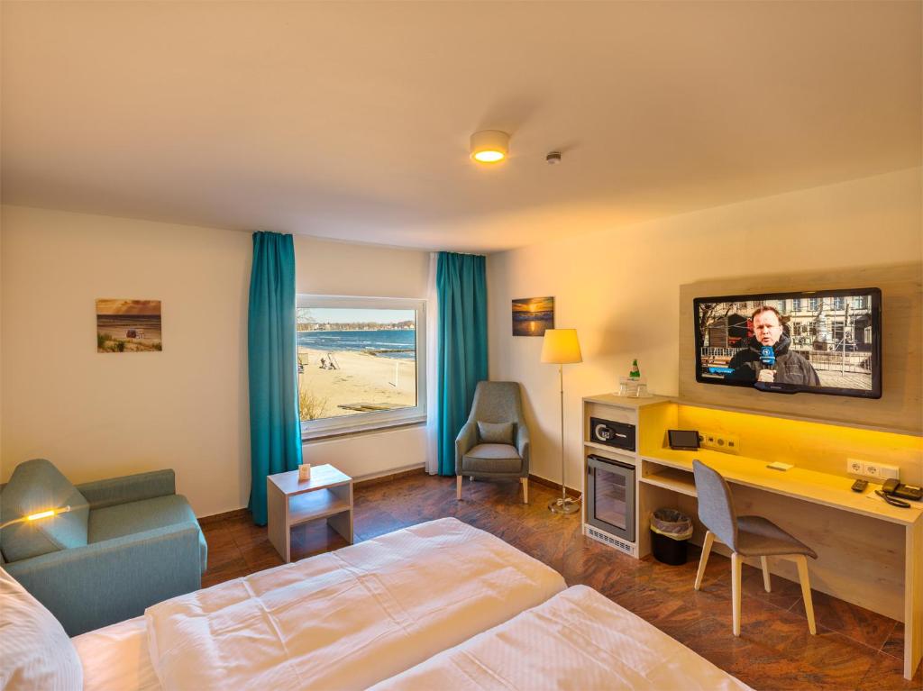 TV a/nebo společenská místnost v ubytování Hotel Seelust