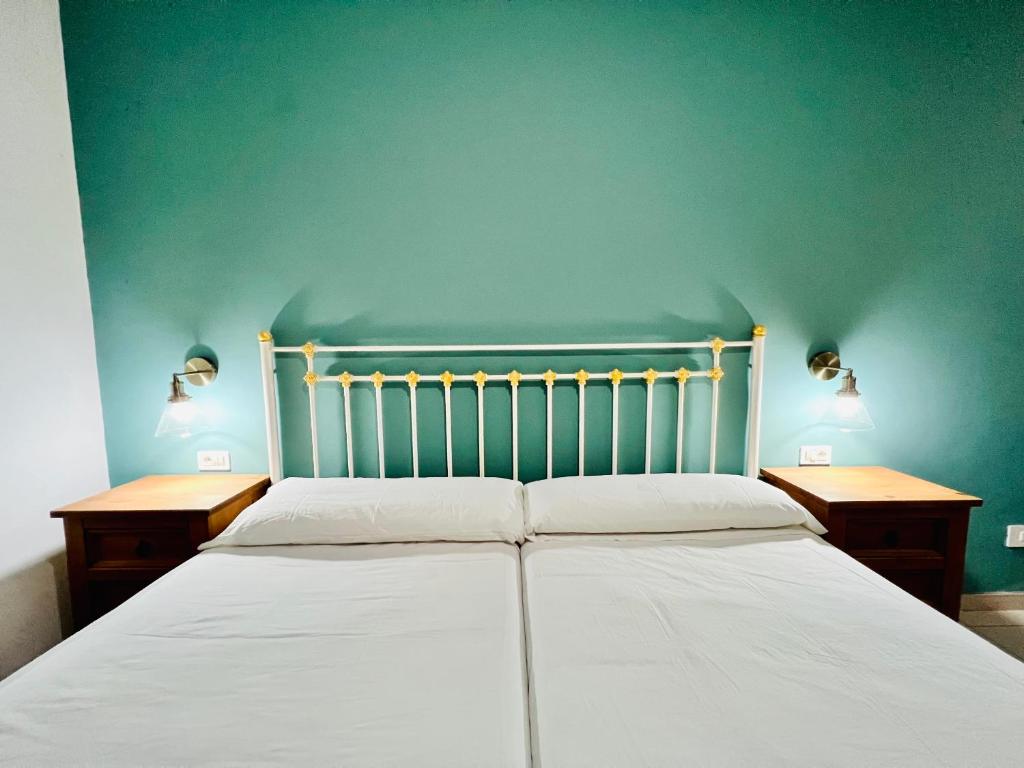 A bed or beds in a room at Apartamentos Frontera