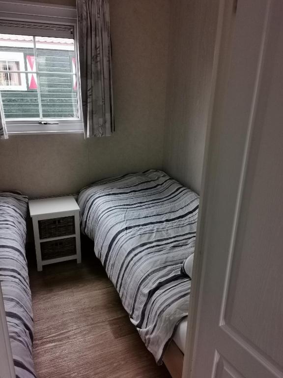 Postel nebo postele na pokoji v ubytování Chalet - Dà gae nog à