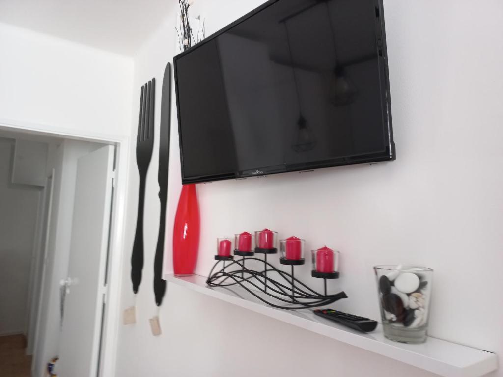 TV a/nebo společenská místnost v ubytování Apartamentos Bela Vista