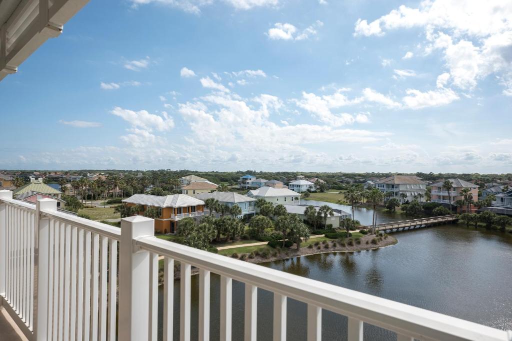 a balcony with a view of a river and houses at 952 Cinnamon Beach, Sleeps 6, 3 Bedroom, WiFi, Elevator, 2 Pools in Palm Coast