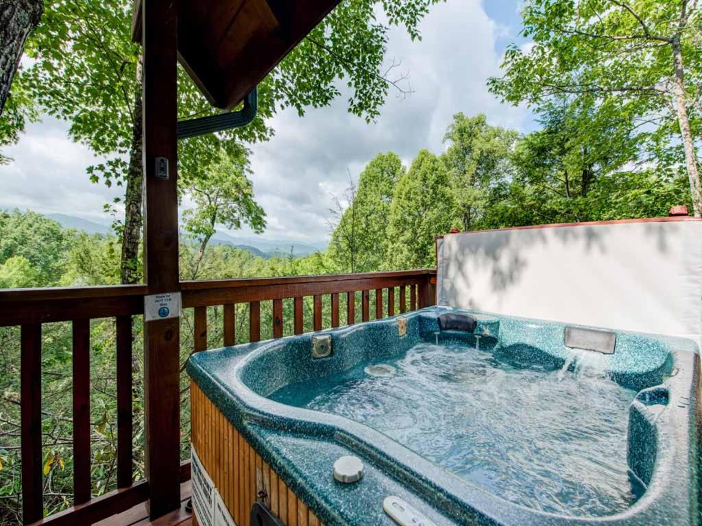 a jacuzzi tub on the deck of a cabin at Cub’s Cove, 1 Bedroom, Near Downtown, View, Jetted Tub, WiFi, Sleeps 4 in Gatlinburg