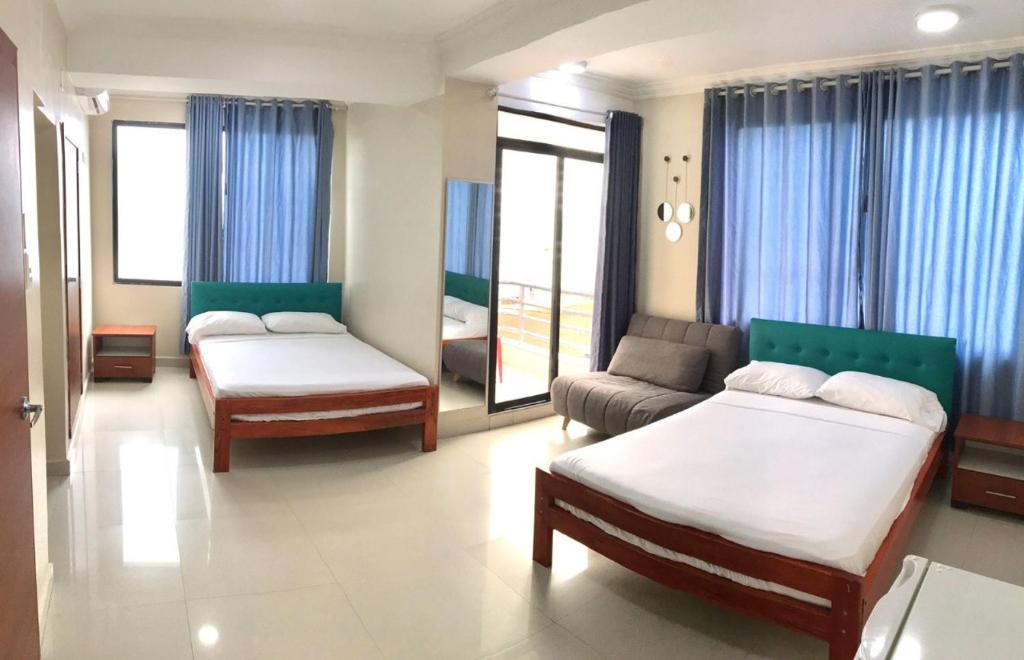 Postel nebo postele na pokoji v ubytování Hotel Andy