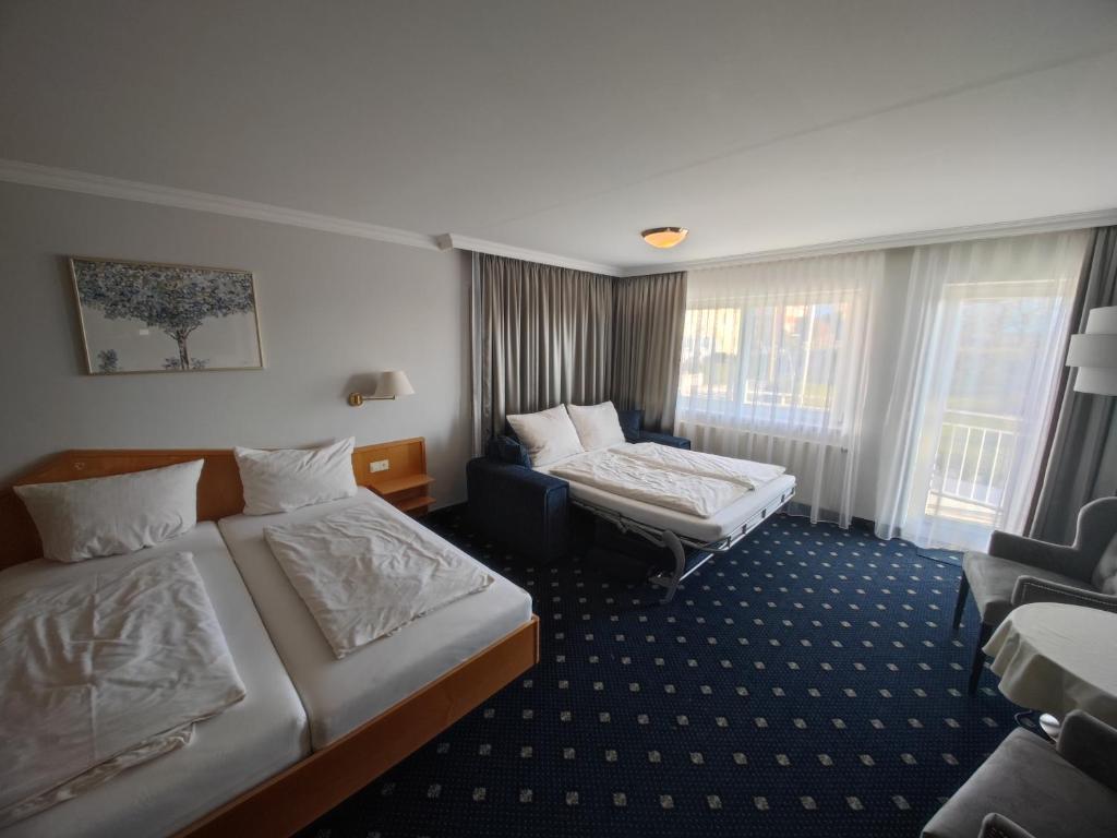 Postel nebo postele na pokoji v ubytování Sporthotel Schönblick
