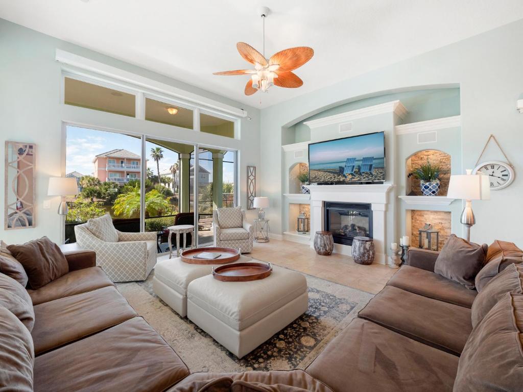 a living room with a couch and a fireplace at Kokomo Key in Palm Coast