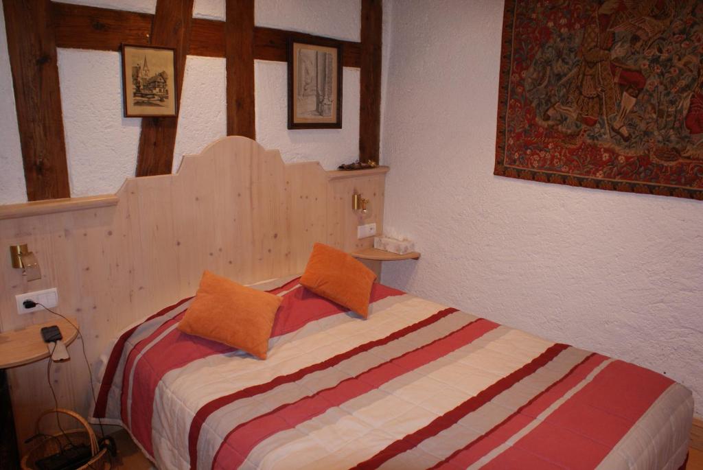 Postel nebo postele na pokoji v ubytování Hôtel Restaurant Le Schlossberg