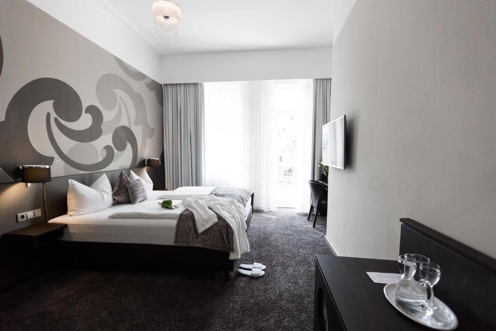 Кровать или кровати в номере Hotel SONATA