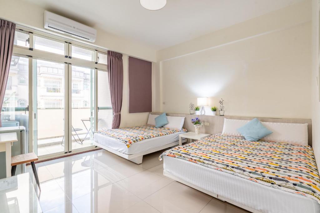 Postel nebo postele na pokoji v ubytování Happy Stay Inn