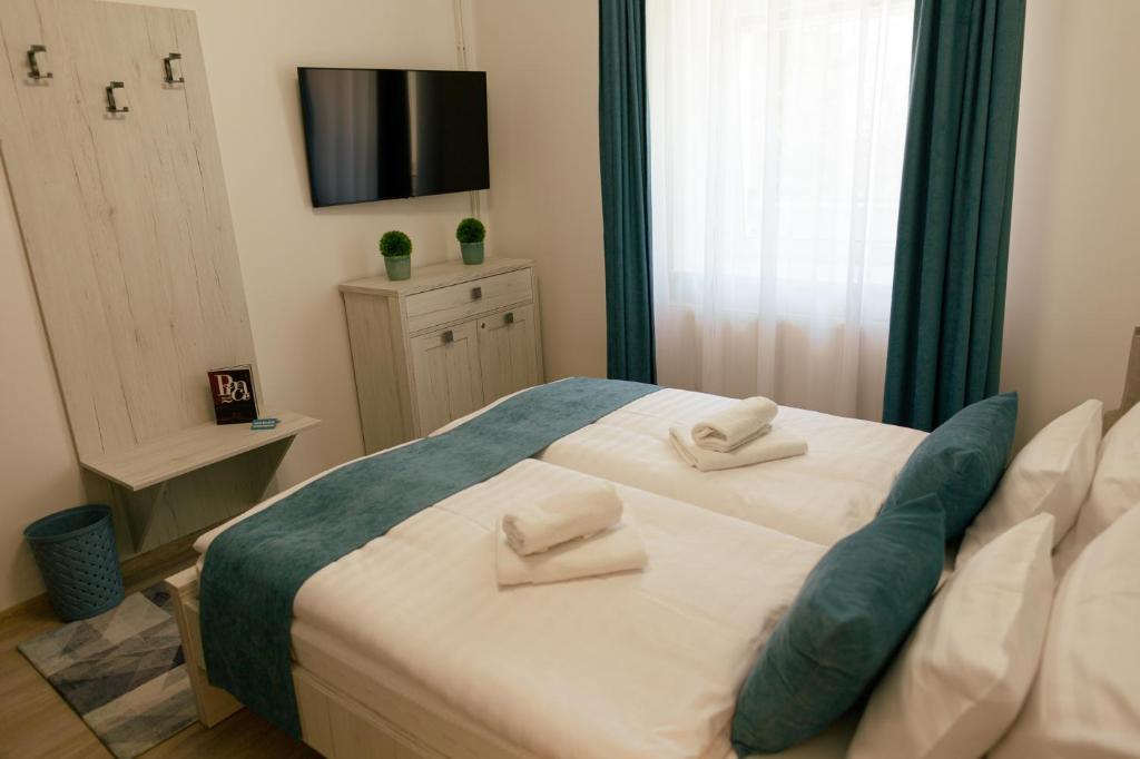 Posteľ alebo postele v izbe v ubytovaní Munkácsy Villa - Szekszárd