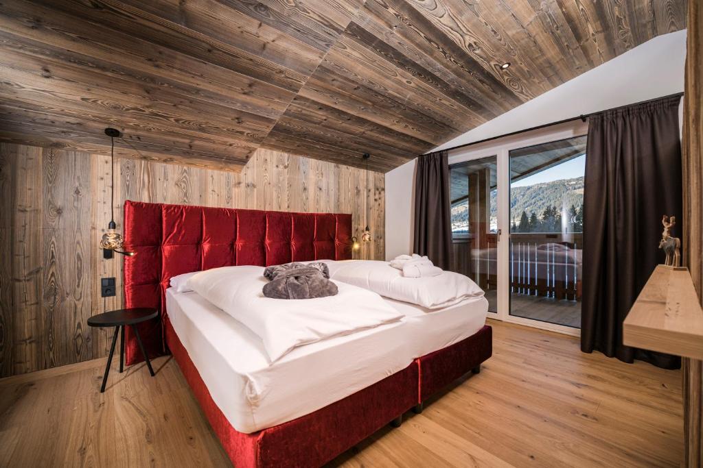 Postel nebo postele na pokoji v ubytování Hotel Laurin