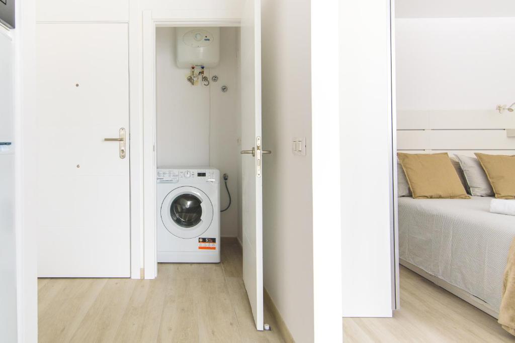 A bed or beds in a room at Home2Book Stylish Las Canteras3 Beach