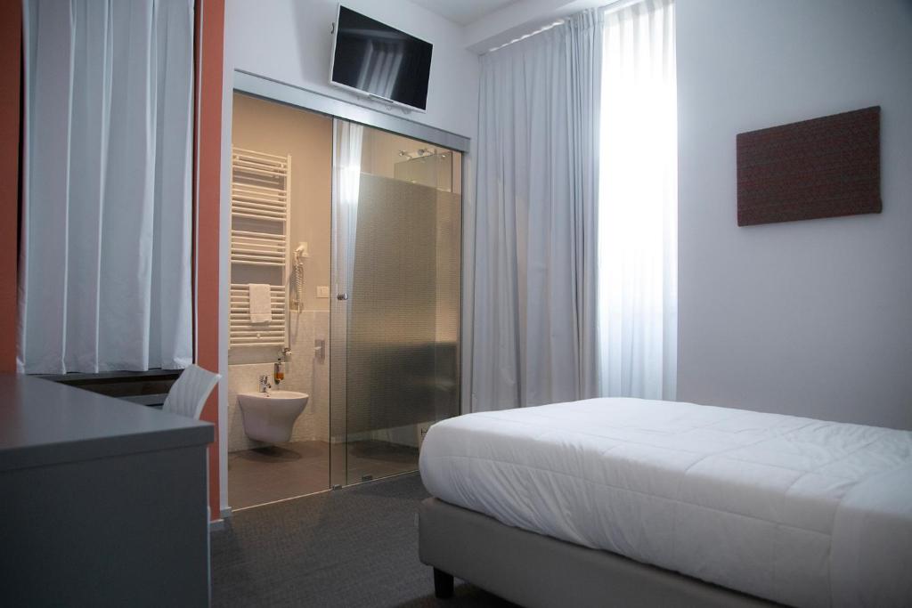 Posteľ alebo postele v izbe v ubytovaní Executive Inn Boutique Hotel