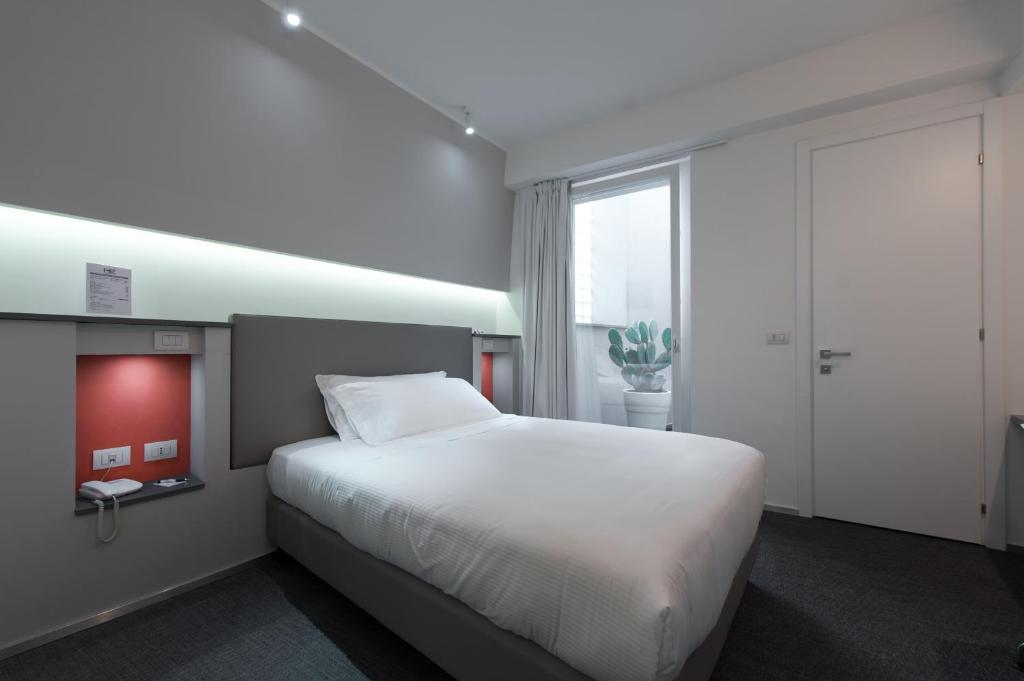 Posteľ alebo postele v izbe v ubytovaní Executive Inn Boutique Hotel