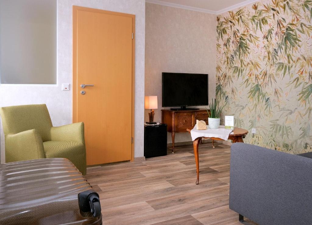 TV a/nebo společenská místnost v ubytování Landgasthaus Hoffmann