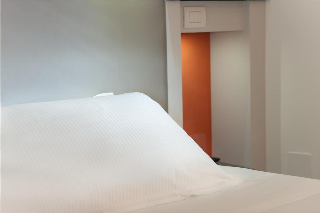 Posteľ alebo postele v izbe v ubytovaní Executive Inn Boutique Hotel