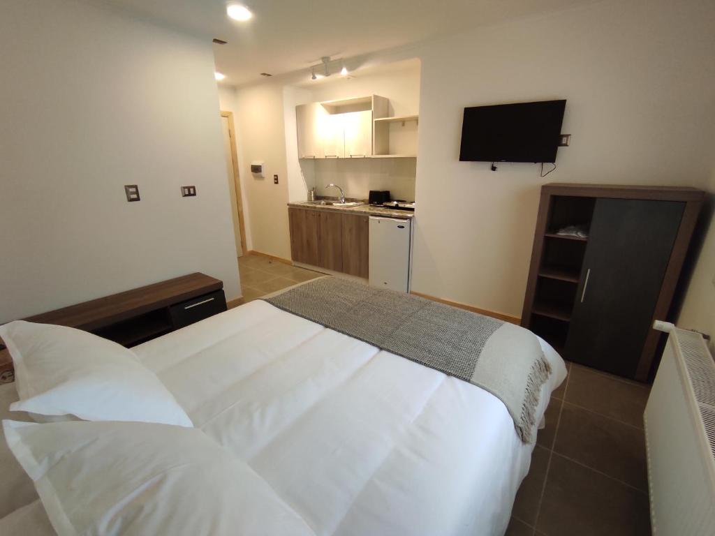 Postel nebo postele na pokoji v ubytování Apart Hotel Endurance