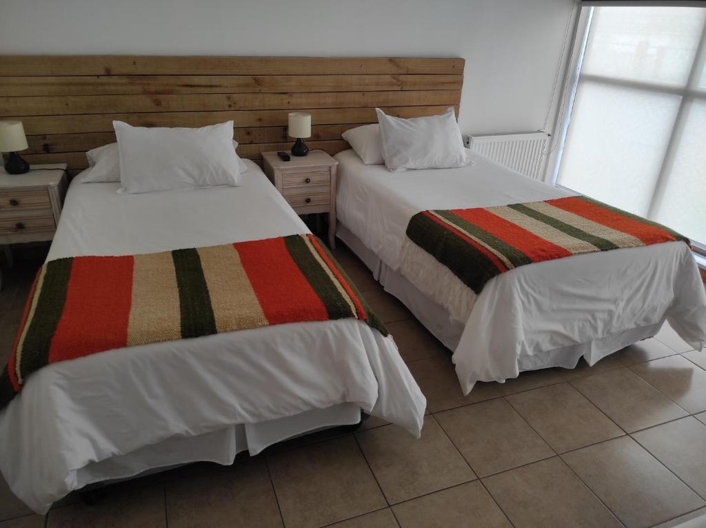 Postel nebo postele na pokoji v ubytování Apart Hotel Endurance