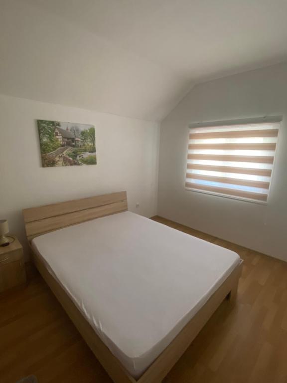 מיטה או מיטות בחדר ב-Apartman Simona