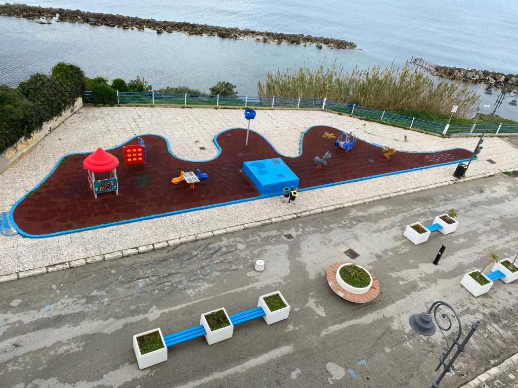 an aerial view of a playground next to the water at Vista Mare in Trappeto