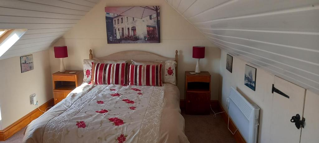 a bedroom with a bed in a attic at Golwg Harddwch in Carmarthen