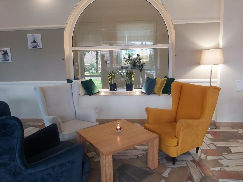 Posezení v ubytování Hotel ***NAT Sarbinowo