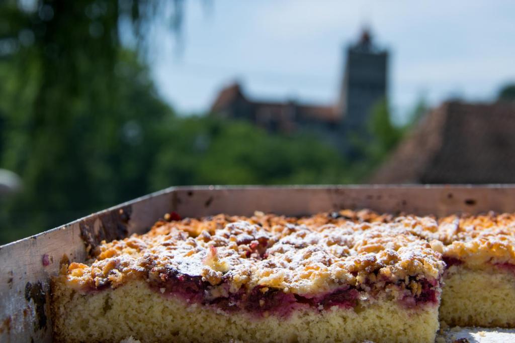 a cake sitting in a pan on a table at Pension Mama Cozonacilor in Bran