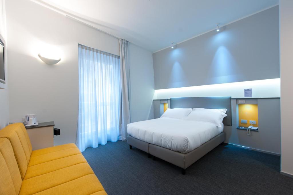 Posteľ alebo postele v izbe v ubytovaní Executive Inn Boutique Hotel