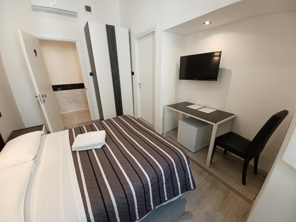 TV a/nebo společenská místnost v ubytování Hotel Mimosa Pantheon