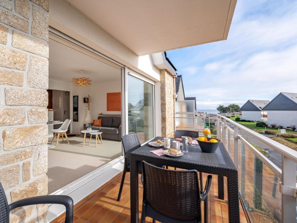 a patio with a table and chairs on a balcony at Apartment Le Yacht Club by Interhome in Quiberon