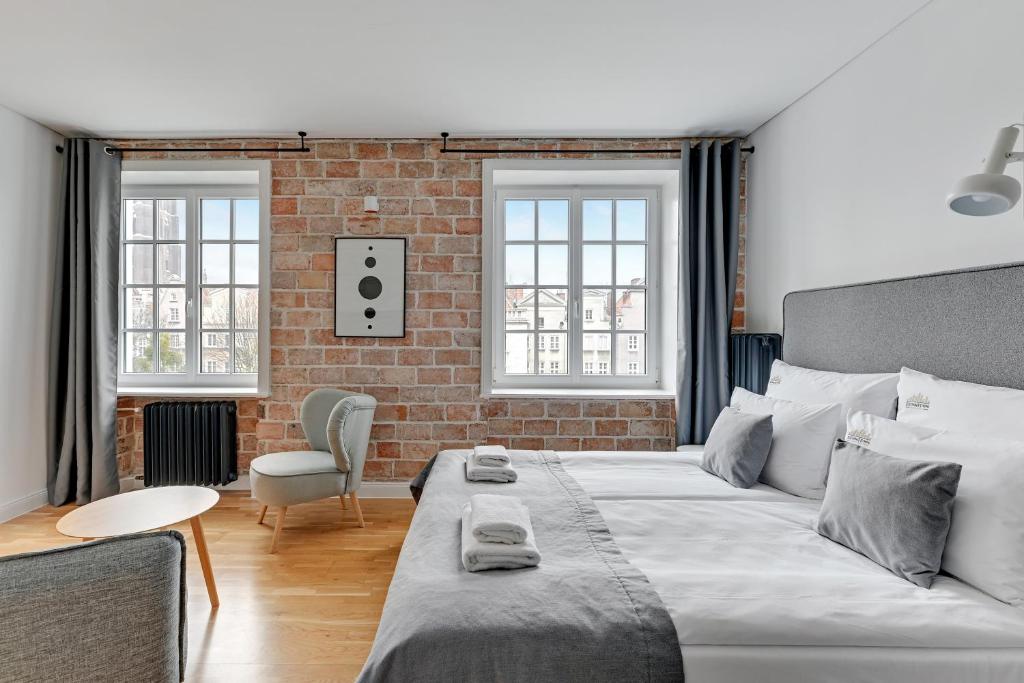 Posteľ alebo postele v izbe v ubytovaní Szeroka Boutique by Downtown Apartments