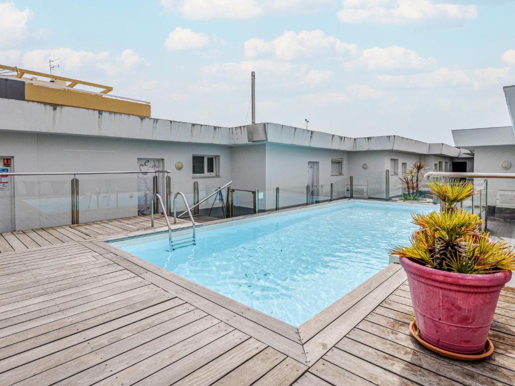 a swimming pool on the roof of a building at Apartment Dolce Vita by Interhome in Saint-Laurent-du-Var
