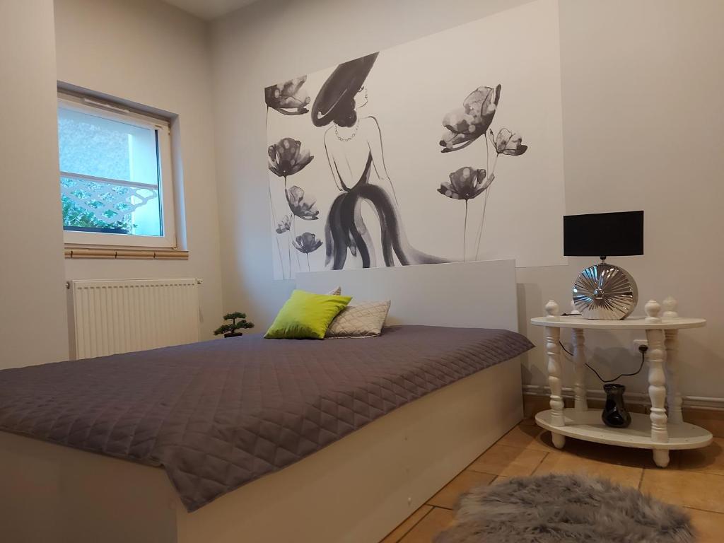 Postel nebo postele na pokoji v ubytování Apartament Przy Ratuszu