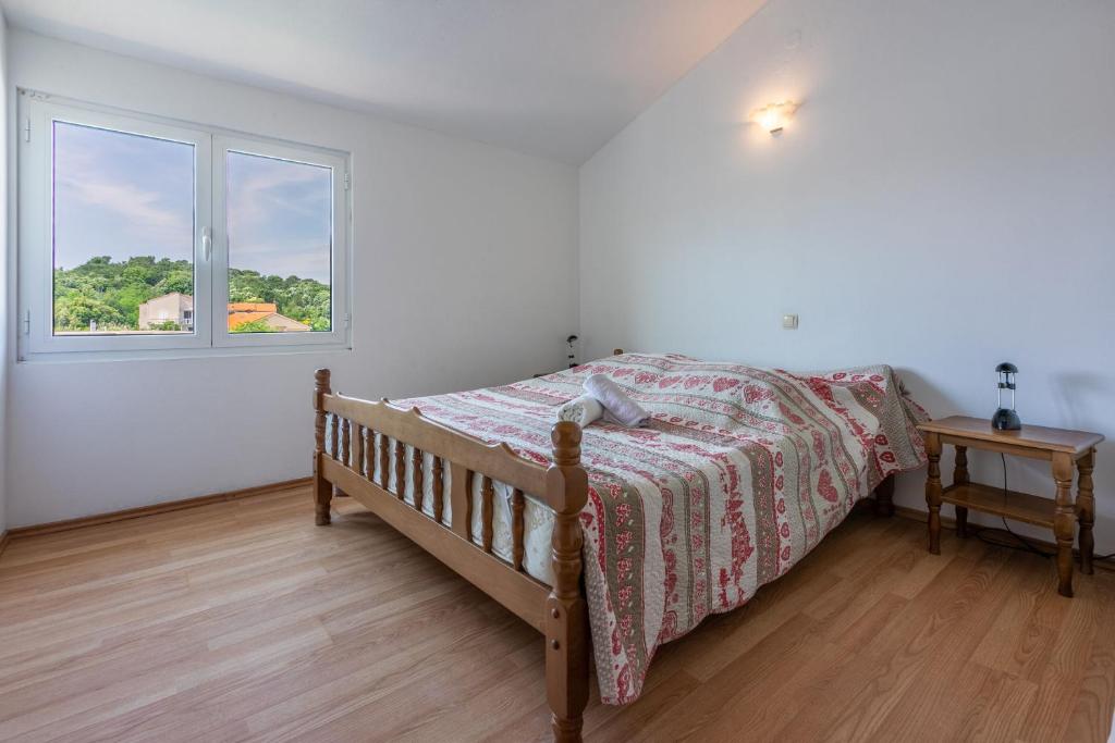 Postel nebo postele na pokoji v ubytování Apartments Lino