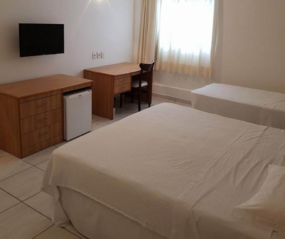 Postel nebo postele na pokoji v ubytování Hotel Áster
