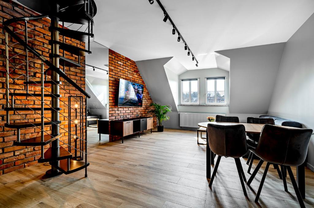 Televízia a/alebo spoločenská miestnosť v ubytovaní BanApart Exclusive Apartments