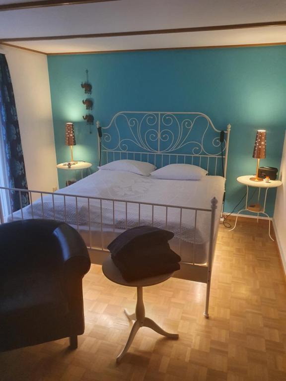 Postel nebo postele na pokoji v ubytování BnB Haus Weibel