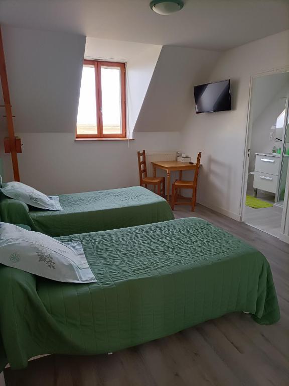 Postel nebo postele na pokoji v ubytování Vent des Grèves