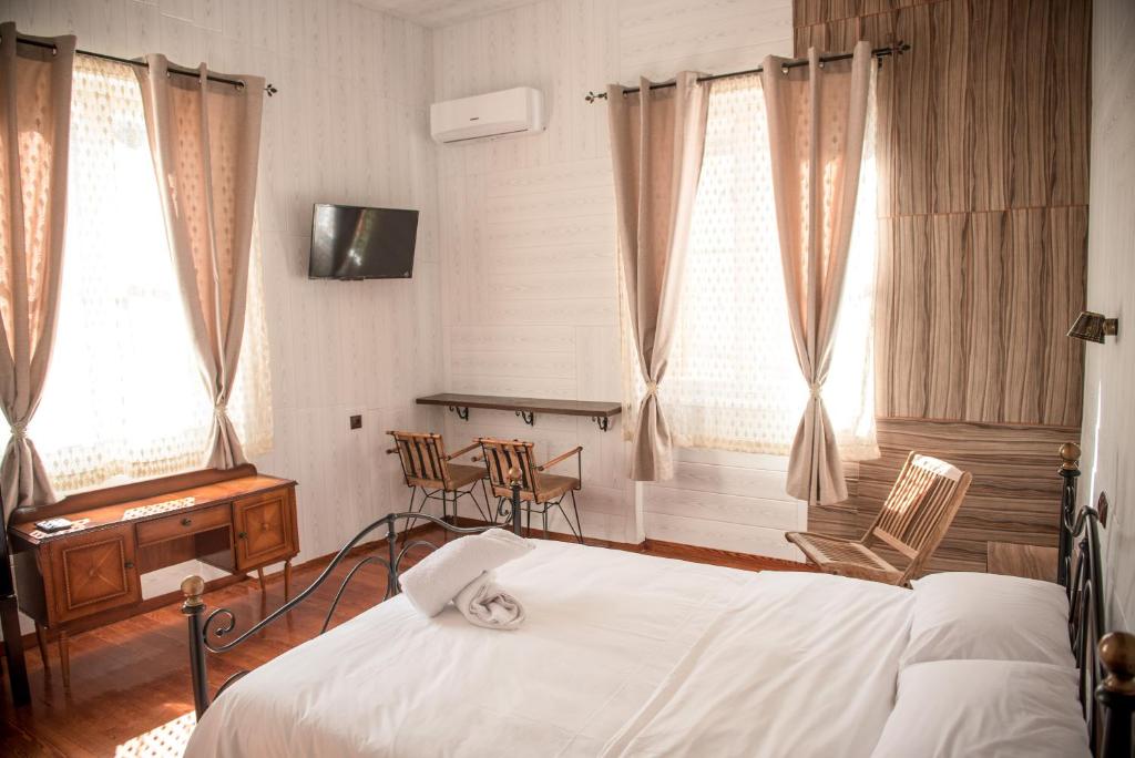 Posteľ alebo postele v izbe v ubytovaní 1920s Rooms