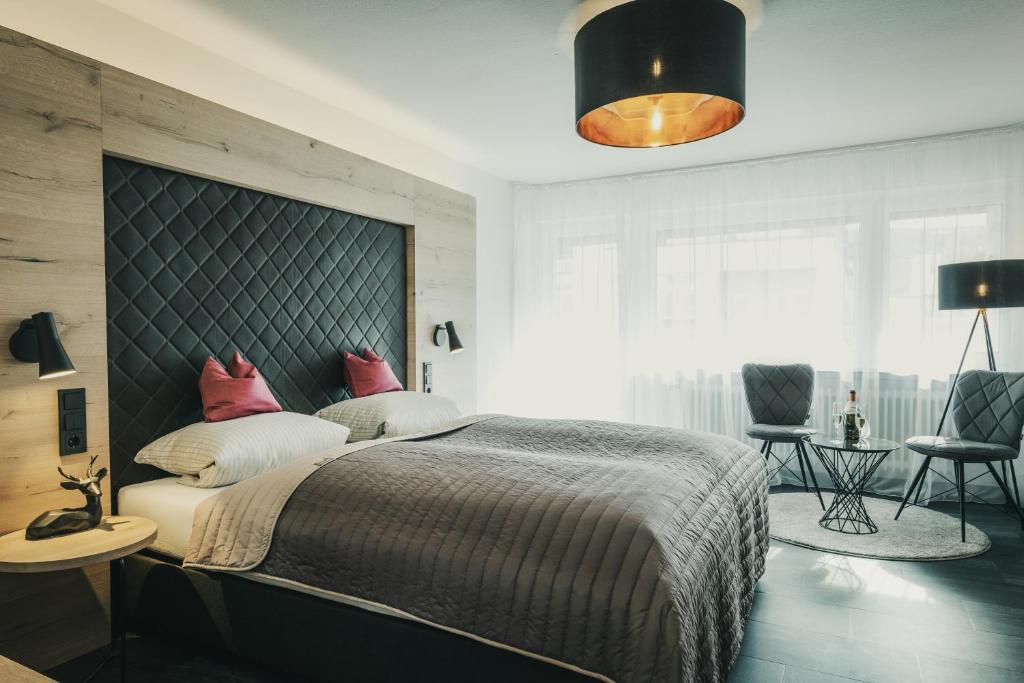 Postel nebo postele na pokoji v ubytování Hotel Koch