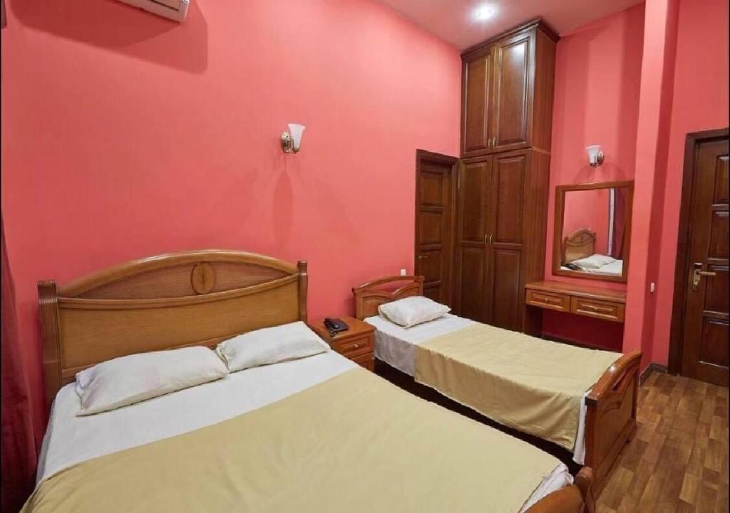 Postel nebo postele na pokoji v ubytování NEW BELLA HOTEL