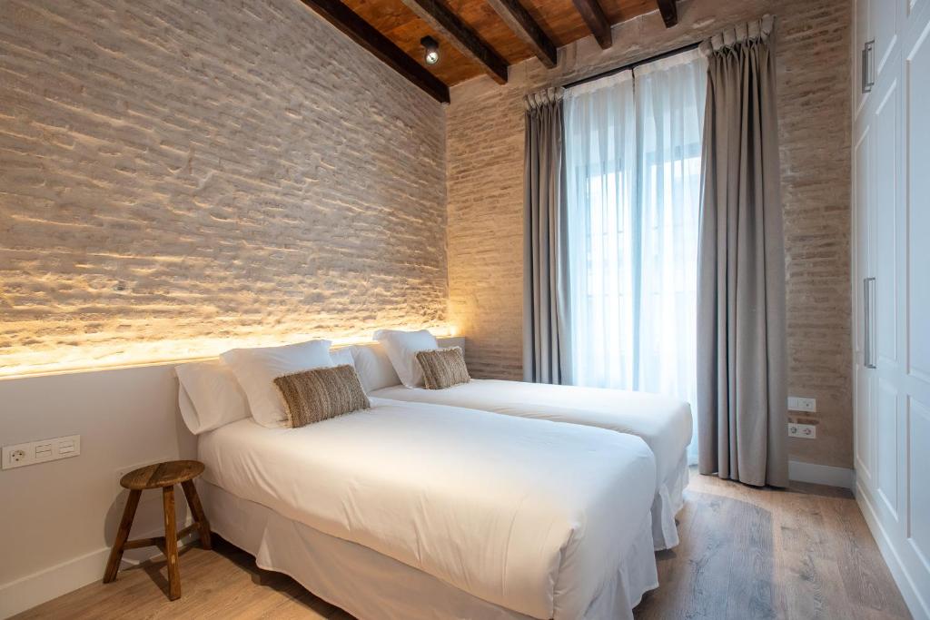 Posteľ alebo postele v izbe v ubytovaní La Sillería de Triana by Magno Apartments