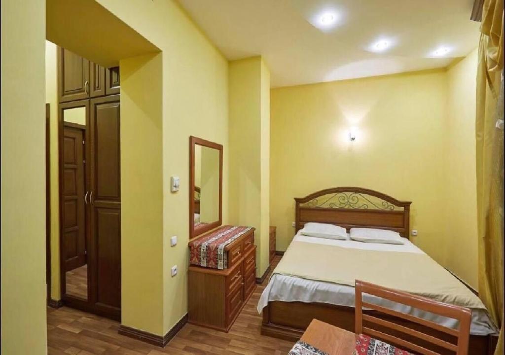 Postel nebo postele na pokoji v ubytování NEW BELLA HOTEL