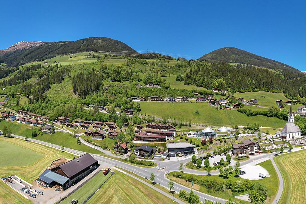 an aerial view of a village in the mountains at Ferienpark Schöneben in Wald im Pinzgau